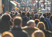 city with a lot of people walking on the streets