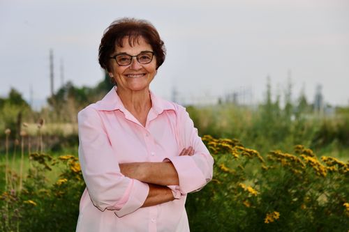 woman standing outside and smiling