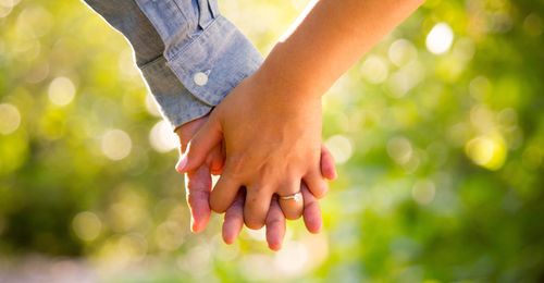 man and woman holding hands