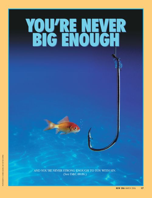 A conceptual photograph of a goldfish swimming beside a large hook, paired with the words “You’re Never Big Enough.”