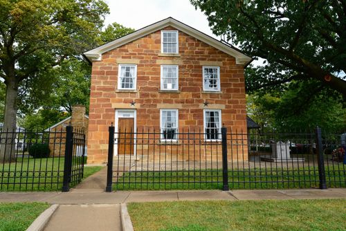A front view of Carthage Jail, a brick building in Illinois, where Joseph and Hyrum Smith were martyred.