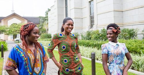 A Ghanan family walks the grounds of the Accra Ghana Temple together.