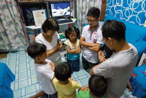 family praying together