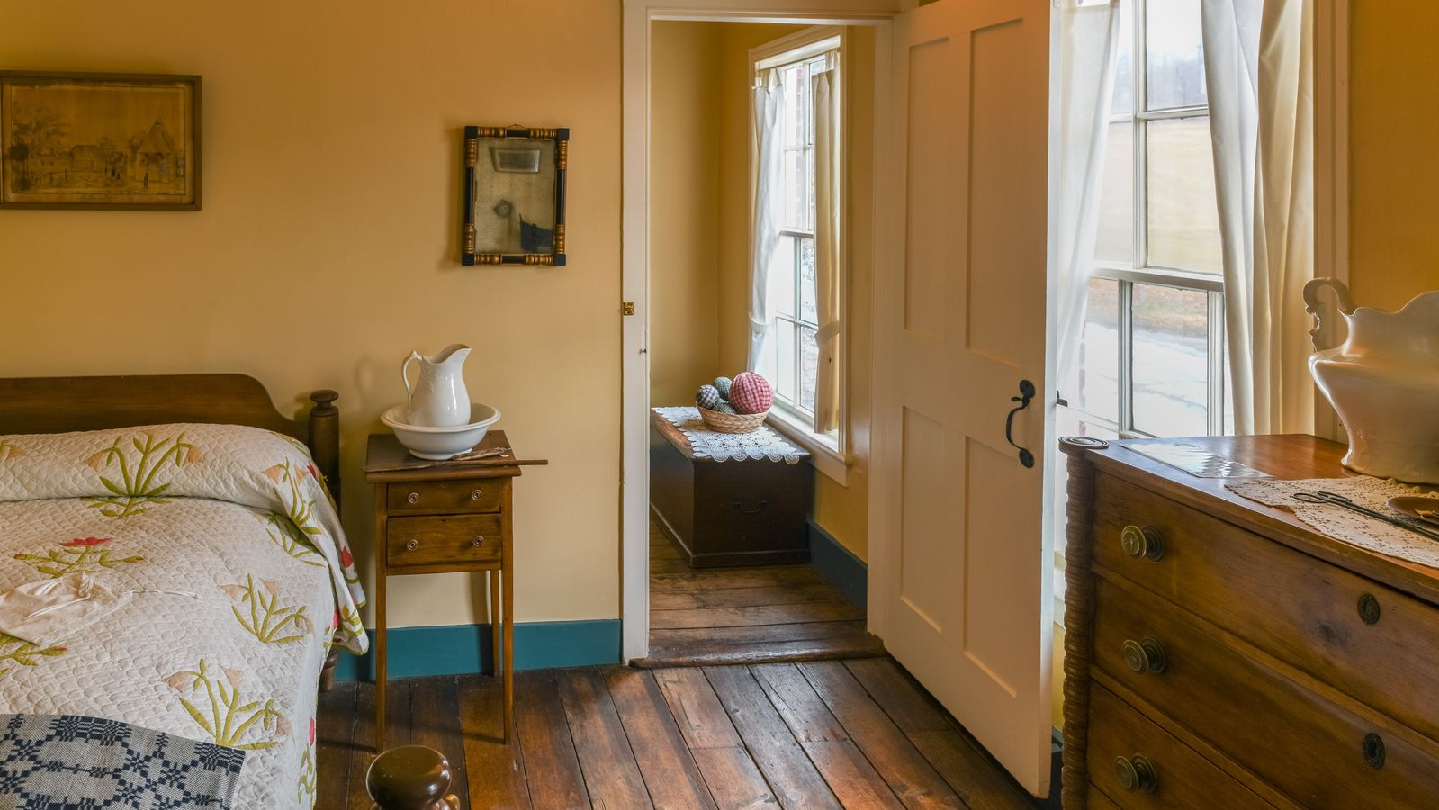 The main bedroom in the Woodruff Home. The tulip-patterned quilt on the bed belonged to Phebe.   - 