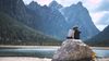 couple sitting on rock