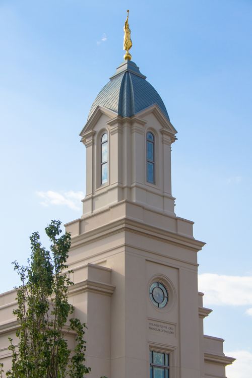 A photograph of the Cedar City Utah Temple steeple topped with a statue of the angel Moroni.