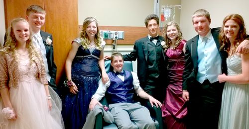 young man with friends in hospital