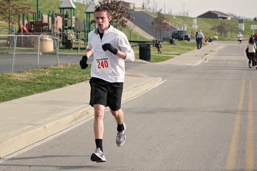 young man running a race