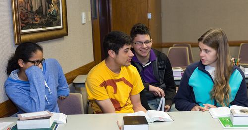 Students talking in a seminary class.