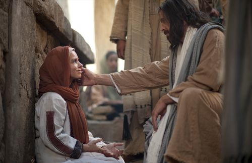 Jesus reaching out to a seated woman