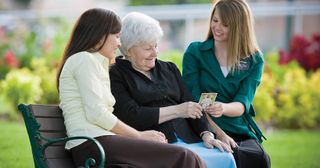 missionaries talking with an elderly person