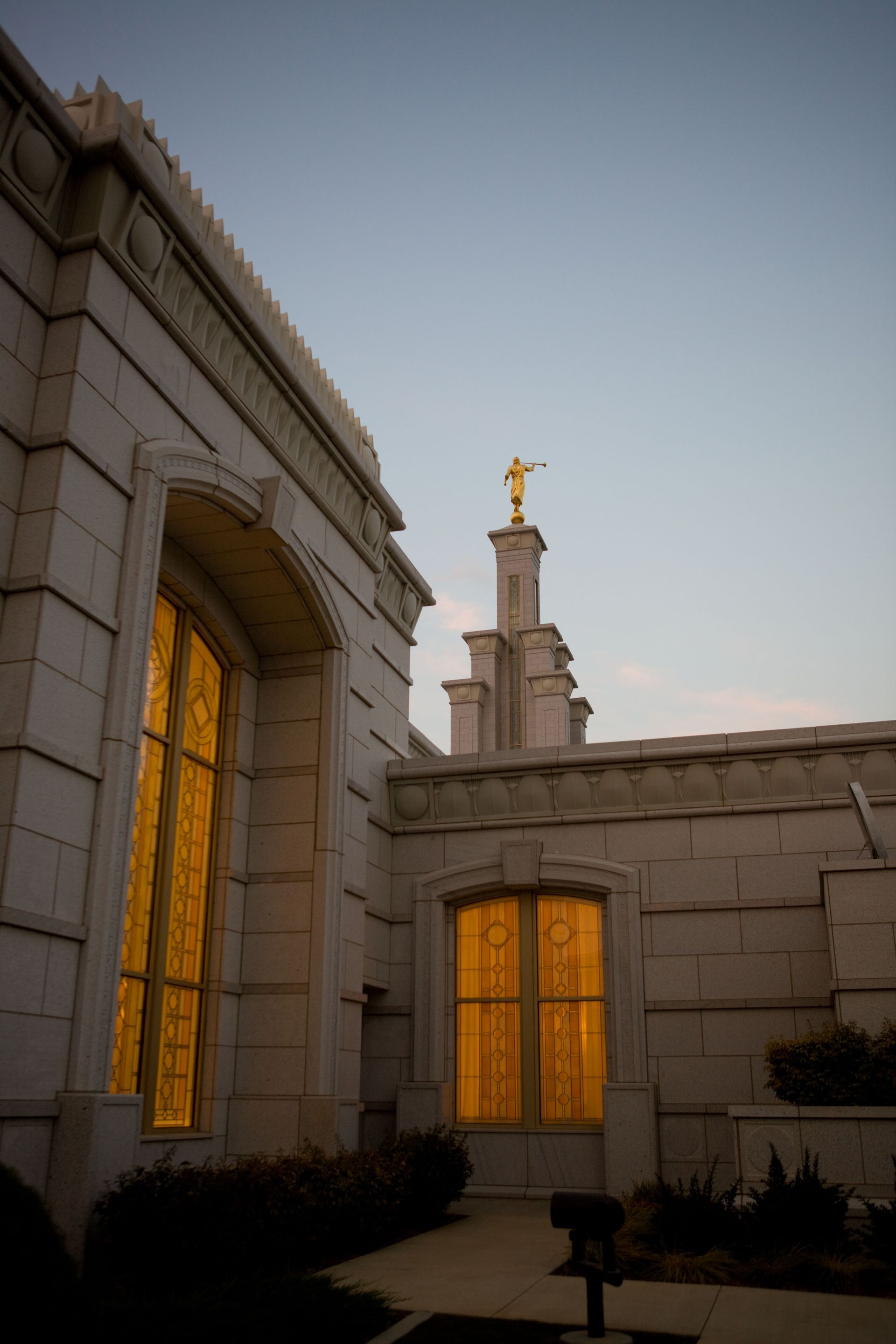 The windows on the side of the Columbia River Washington Temple show lights on within in the late evening.