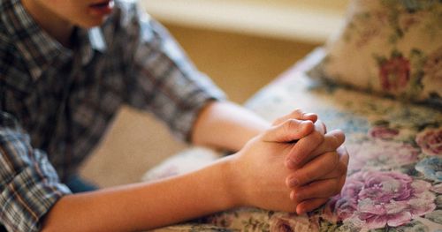 young person praying