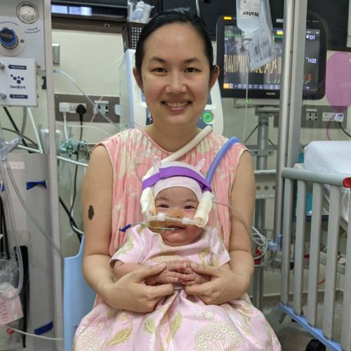 mother holding her daughter in the hospital