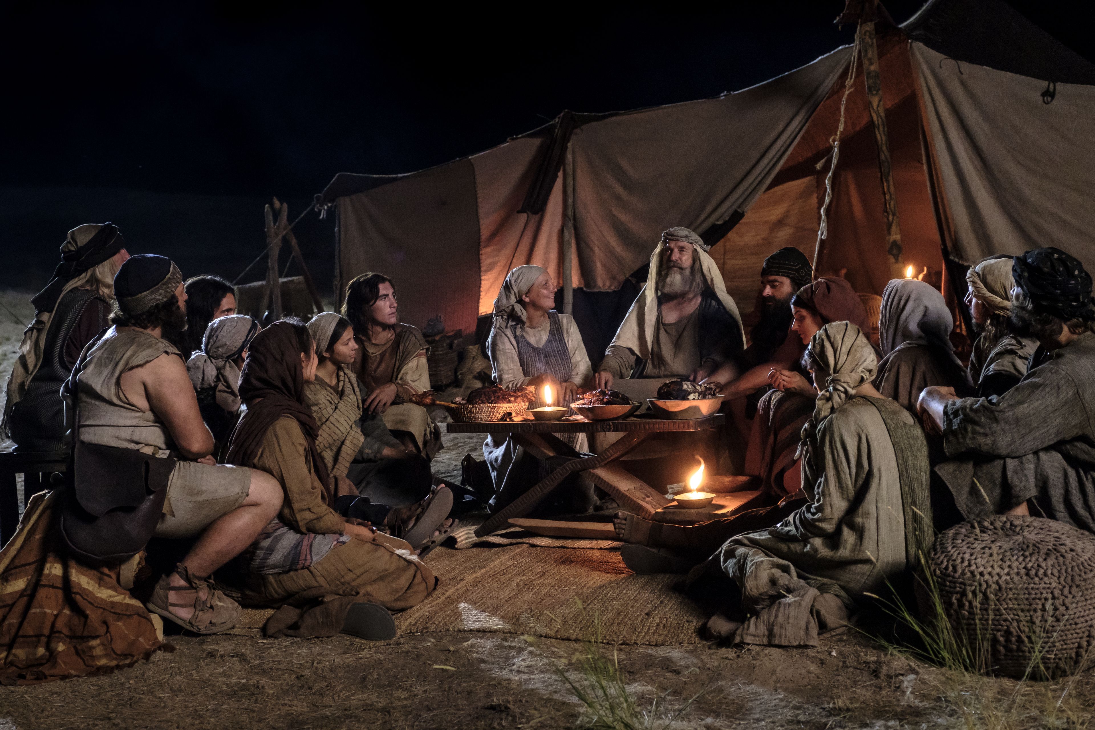 Lehi and Ishmael's families eat in the wilderness after Nephi obtains food.