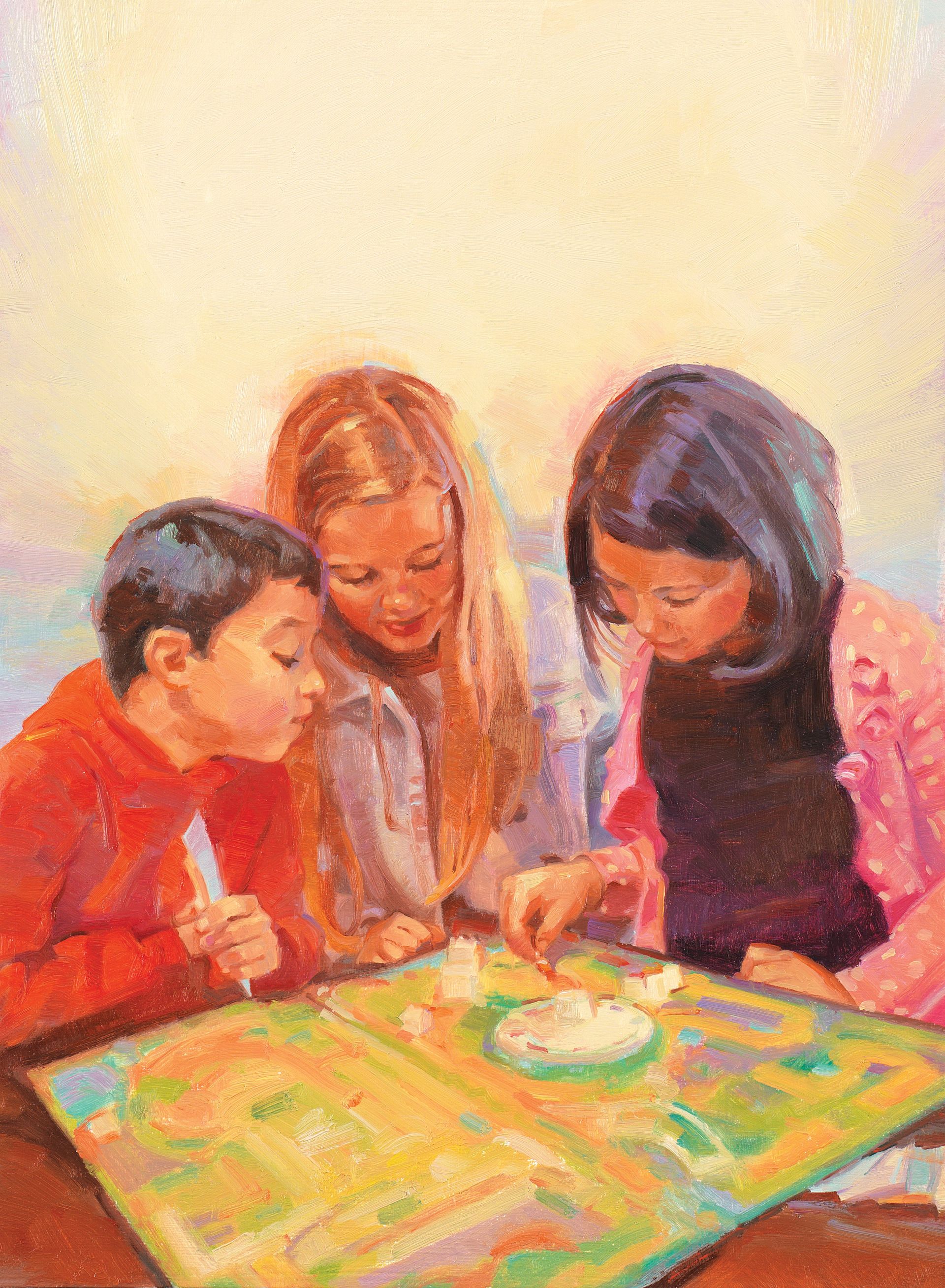 Two sisters and a brother play a board game together.