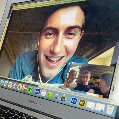 computer screen showing young man visiting online with friends