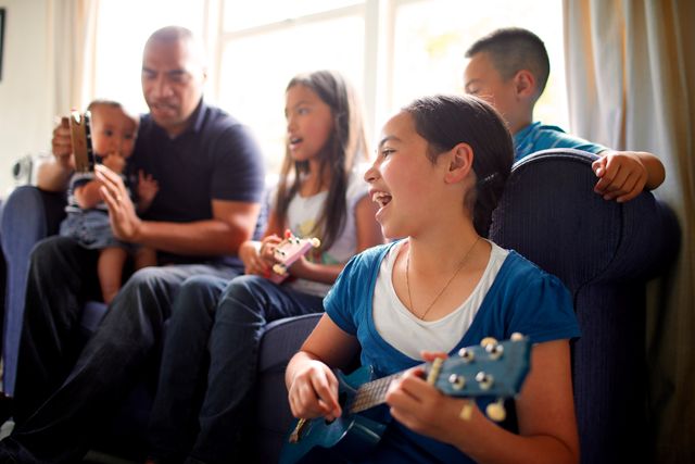 Series of images of family spending time together and female child playing the guitar/ukelele