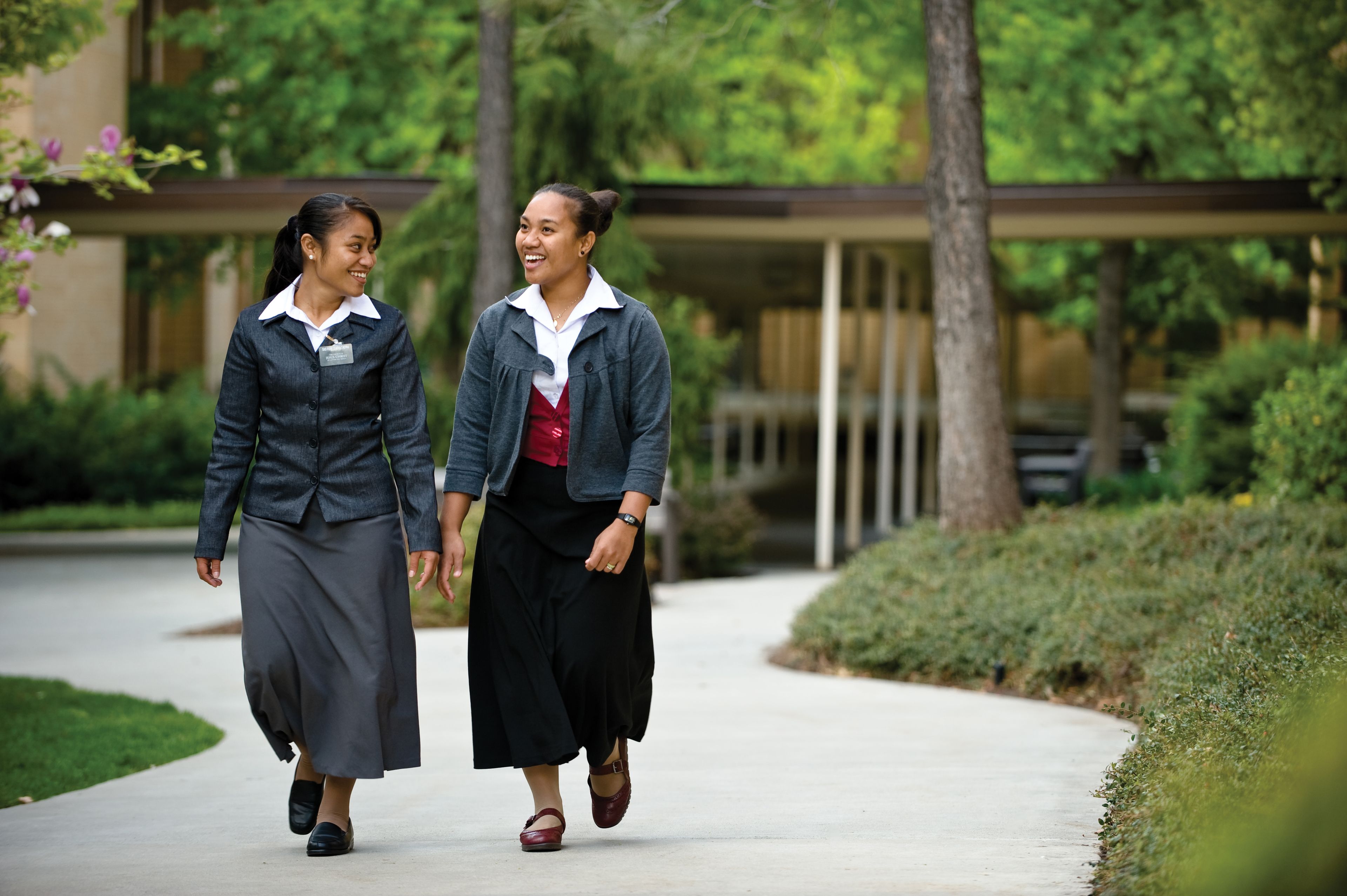 A sister missionary companionship walking at the Missionary Training Center.