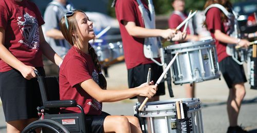young woman in wheelchair in marching band