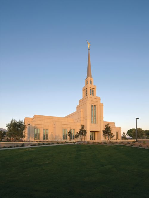 The front entrance to The Gila Valley Arizona Temple in the evening, with the grounds.