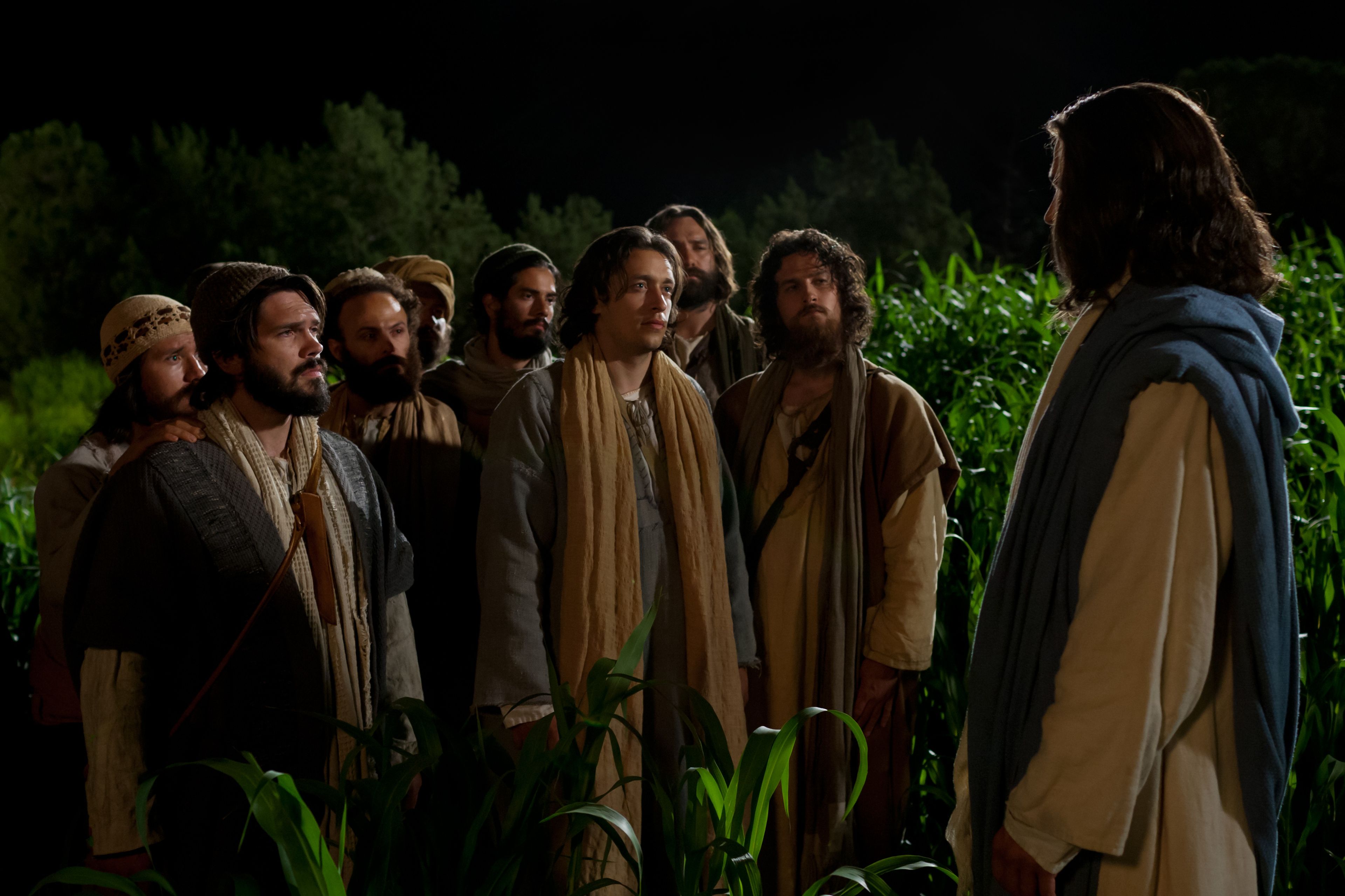Jesus talking to the eleven disciples at night.