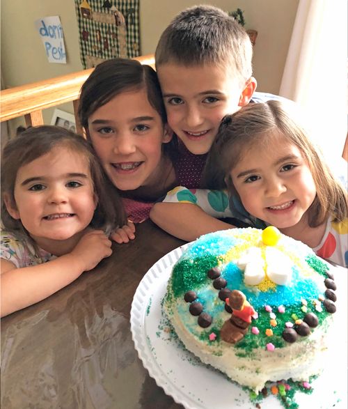 family with decorated cake