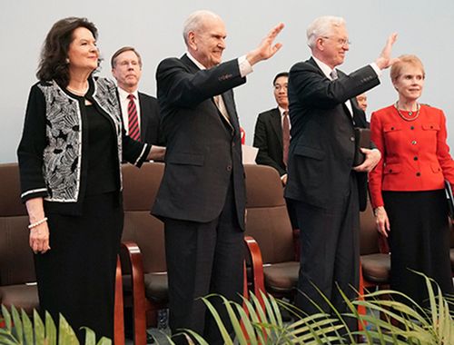 Elder Christofferson and President Nelson waving