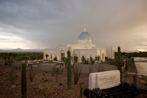 A photograph of the Tucson Arizona Temple beneath a stormy sky.