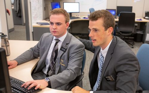 service missionaries at a computer