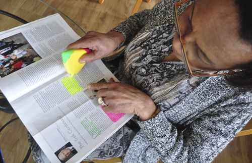 woman studying magazine