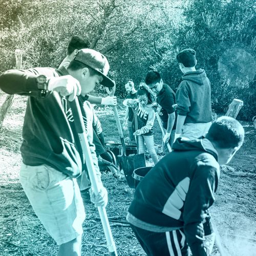 youth with shovels at service project