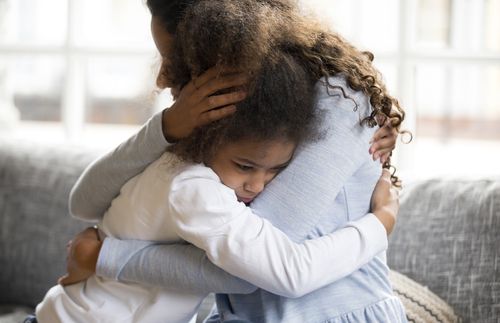 mother and daughter embracing