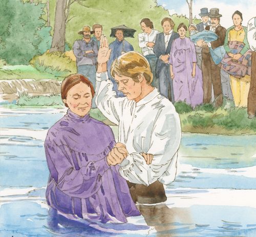 man baptizing woman