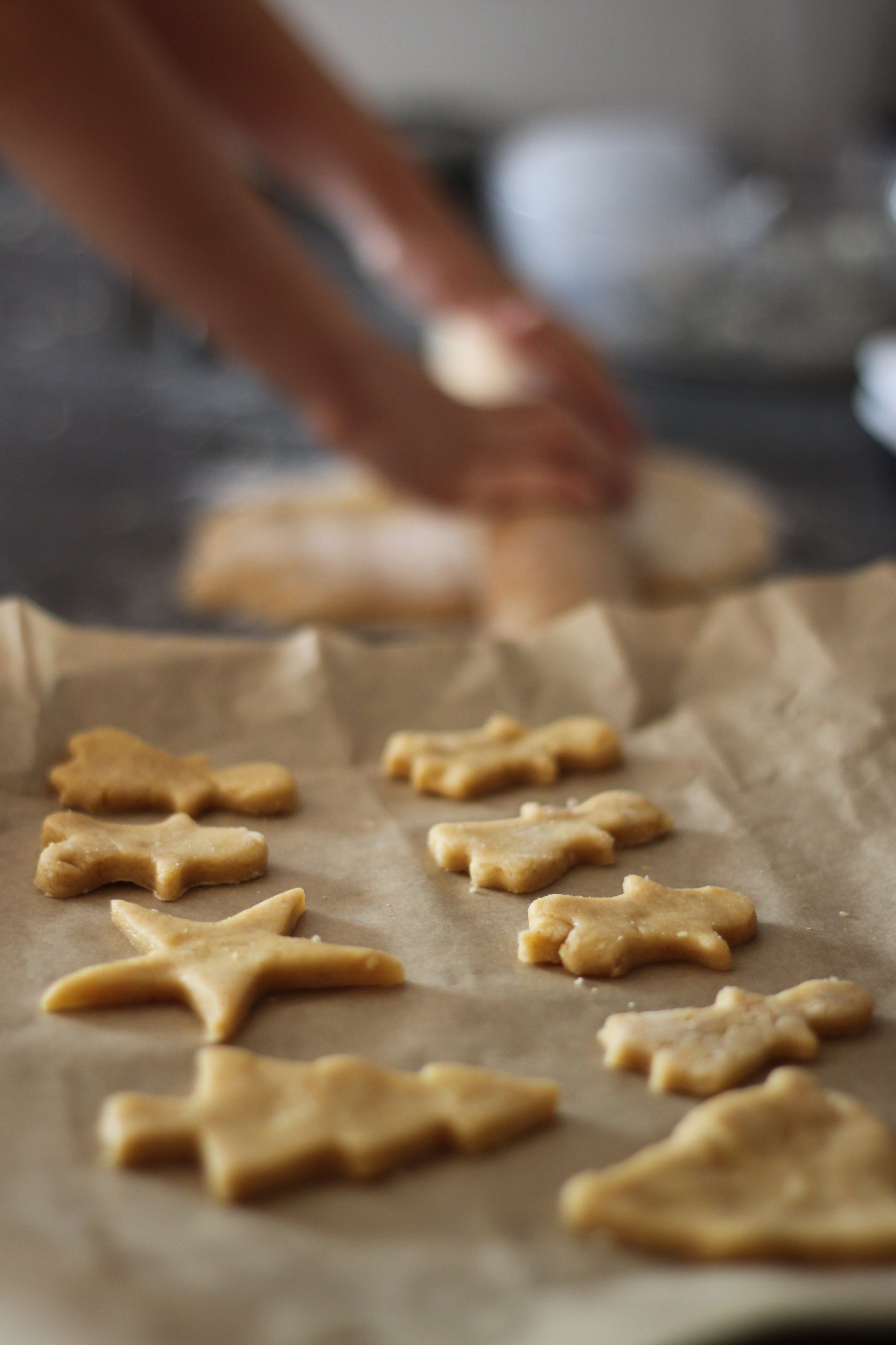 Cut-out cookies on a cookie sheet.