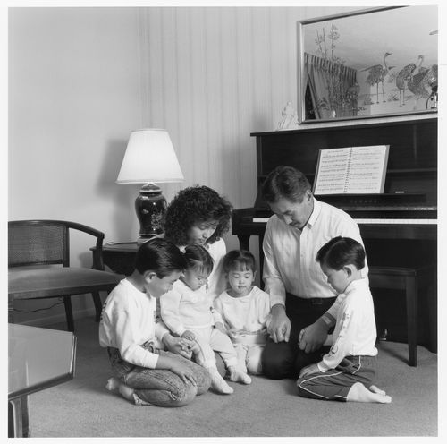 family praying together