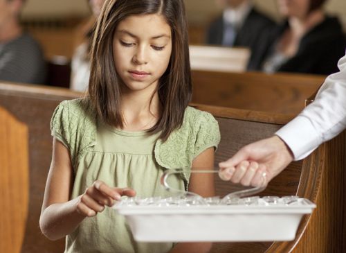 girl taking the sacrament