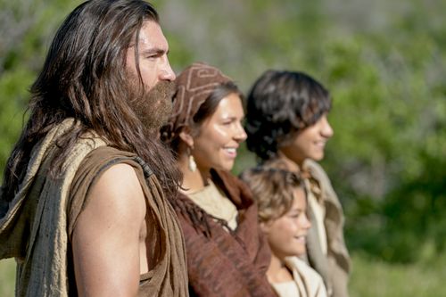 Nephi and his family stand together outside.