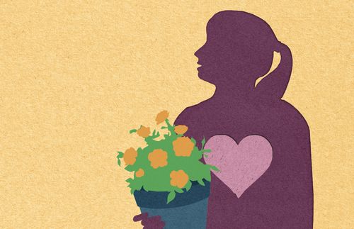 silhouette of woman holding potted flowers