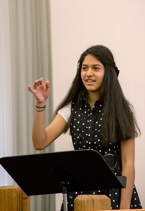 Young woman leading music