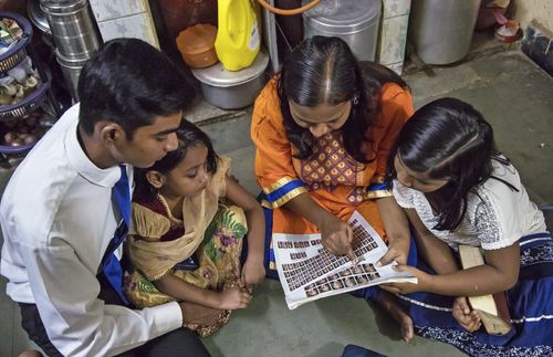 family looking at Church leader chart