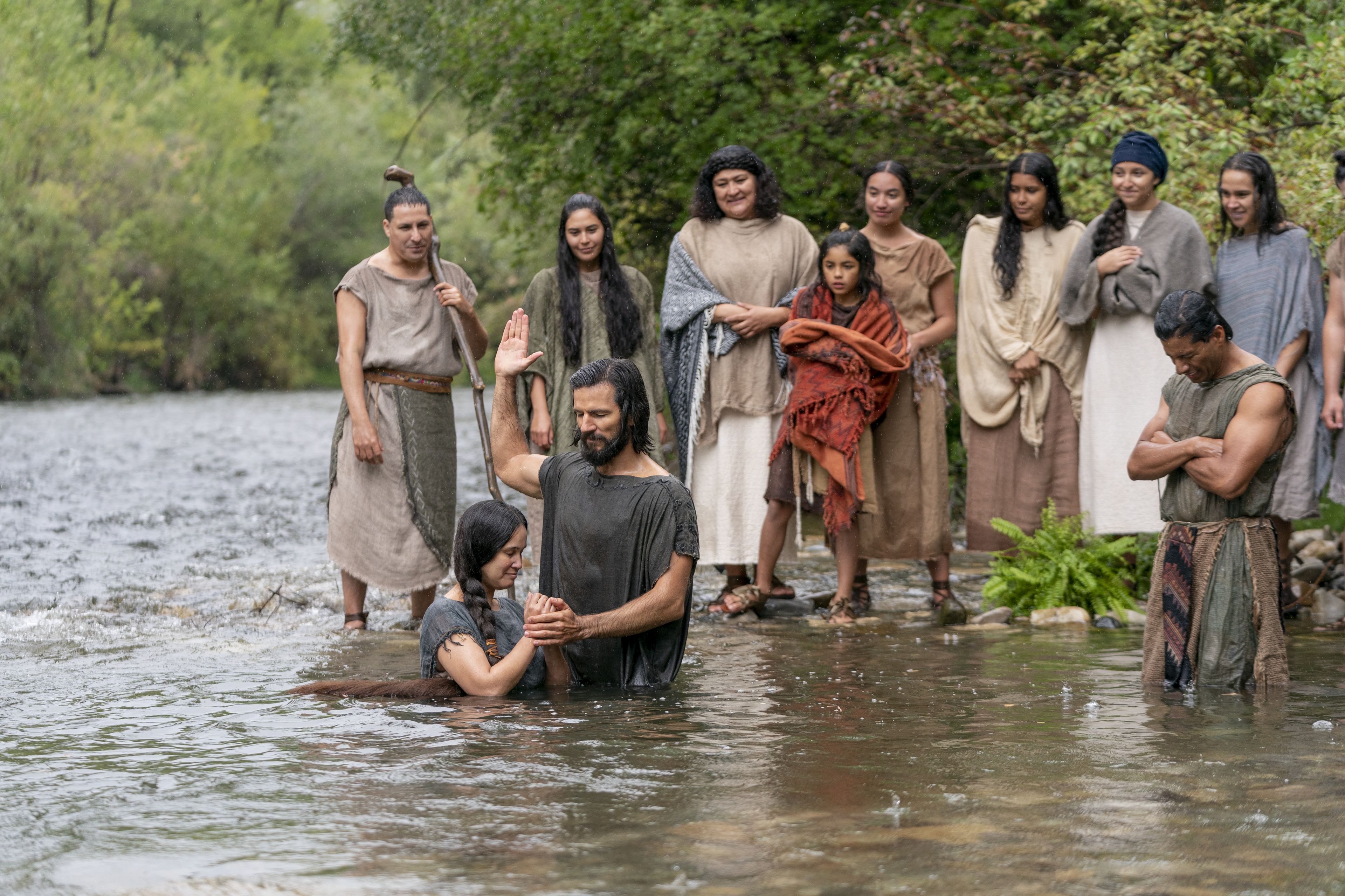 Alma the Younger baptizes believers in the land of Zarahemla.