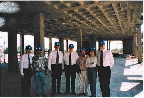 project team at temple construction site