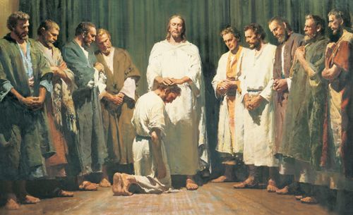 Christ with the twelve men chosen by Him to be His Apostles. Christ has His hands upon the head of one of the men (who kneels before Him) as He ordains the man to be an Apostle. The other eleven Apostles are standing to the left and right of Christ.