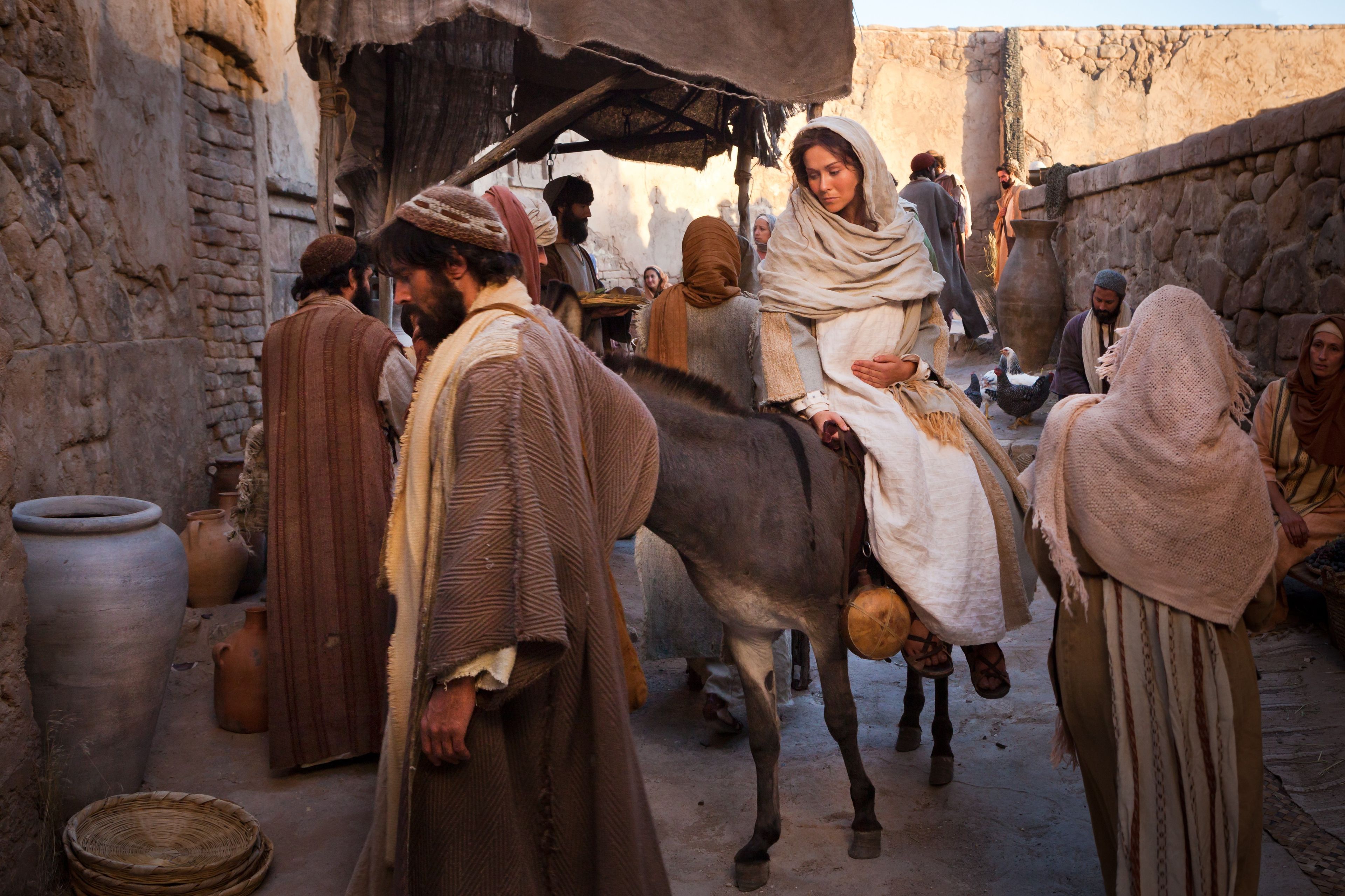 Mary and Joseph enter Bethlehem and begin searching for an inn.