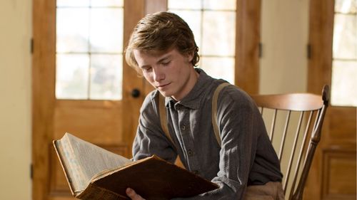 young Joseph Smith studying scriptures