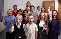 children singing with puppets
