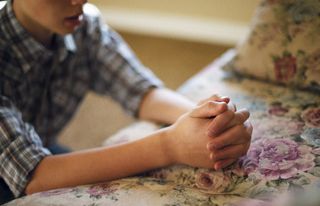 young man praying