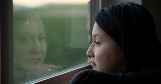 woman looking out of a window