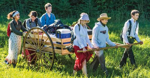 youth pulling handcart